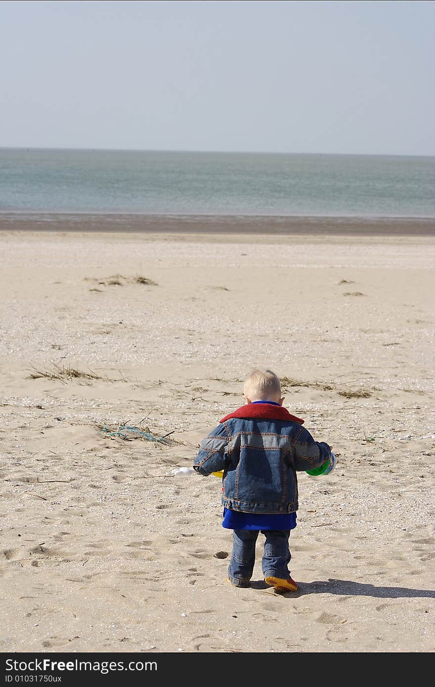 Little boy playing on the beach. Little boy playing on the beach