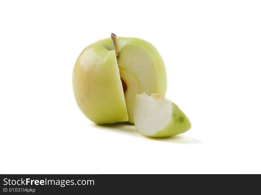 The cut green apple on a white background