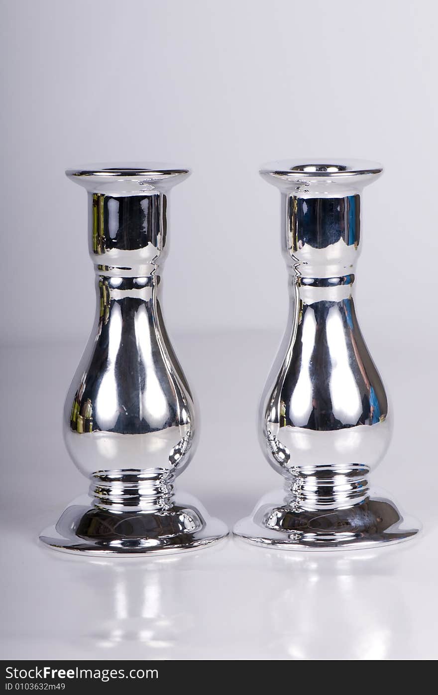 A set of pair shaped pewter candle sticks.