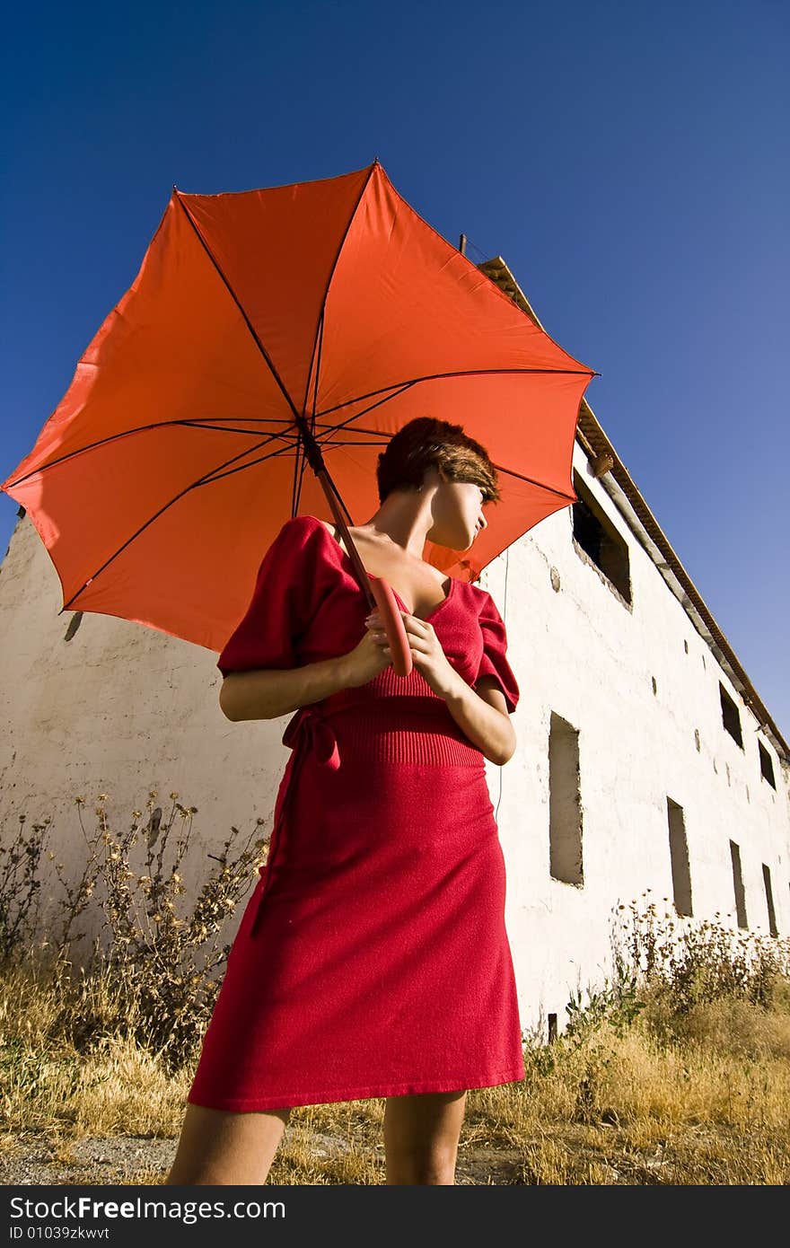 Woman with umbrella, both in red. Woman with umbrella, both in red.