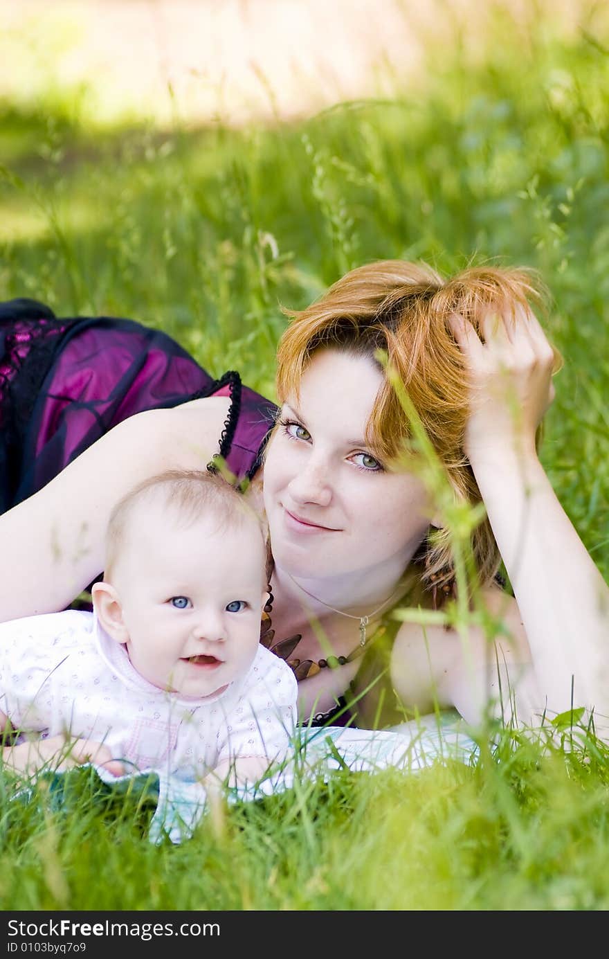 Mother and little child relaxing in the park