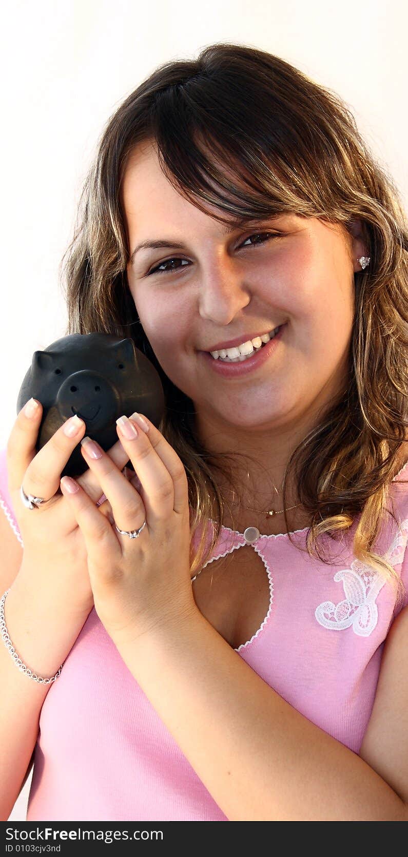 Young lady Holding Piggy Bank