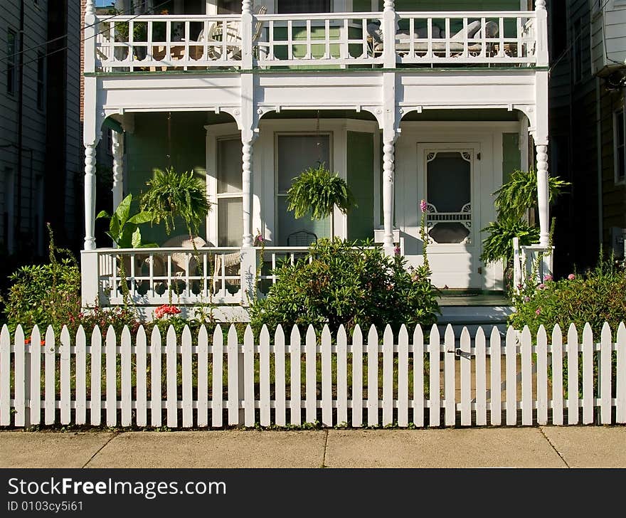 A white picket fence surrounds this beautiful white country home in Ocean Grove, NJ. A white picket fence surrounds this beautiful white country home in Ocean Grove, NJ.