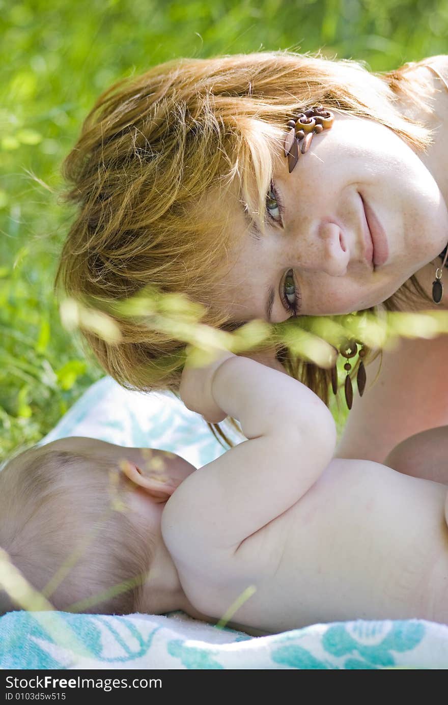 Mother and little child relaxing in the park