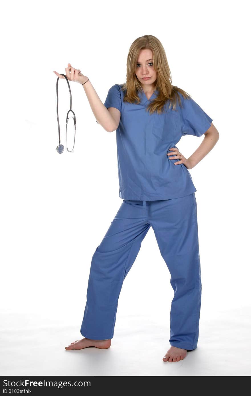 Lady doctor holding stethoscope on one finger and her hand on hip