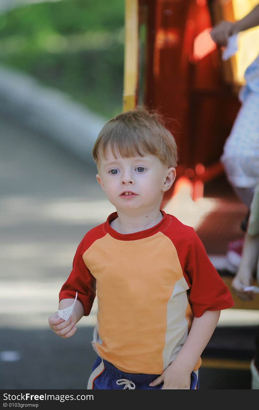 The boy with the ticket in hands. The boy with the ticket in hands