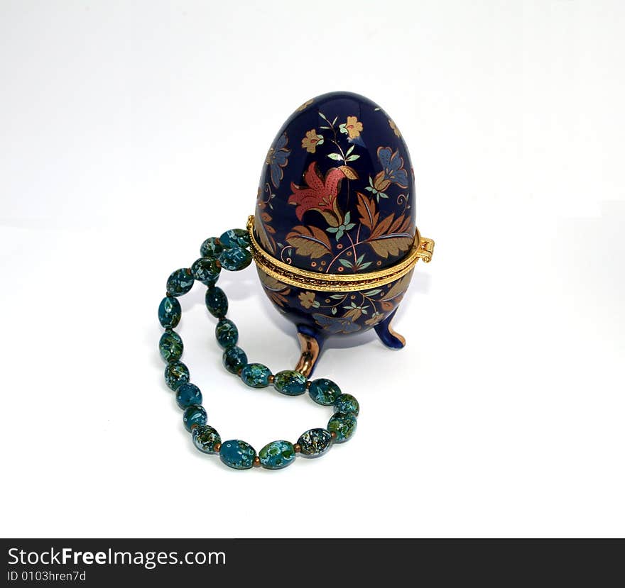 Turquoise necklace in egg-shape porcelain box. Turquoise necklace in egg-shape porcelain box