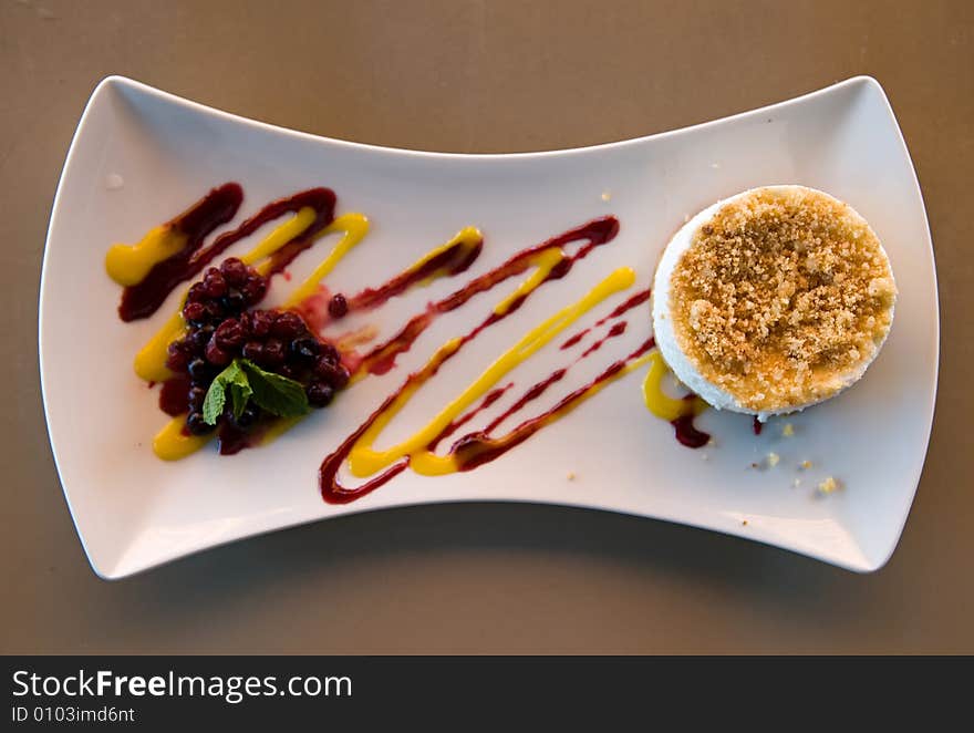 Cheese cake on a decorated plate with fruits. Cheese cake on a decorated plate with fruits