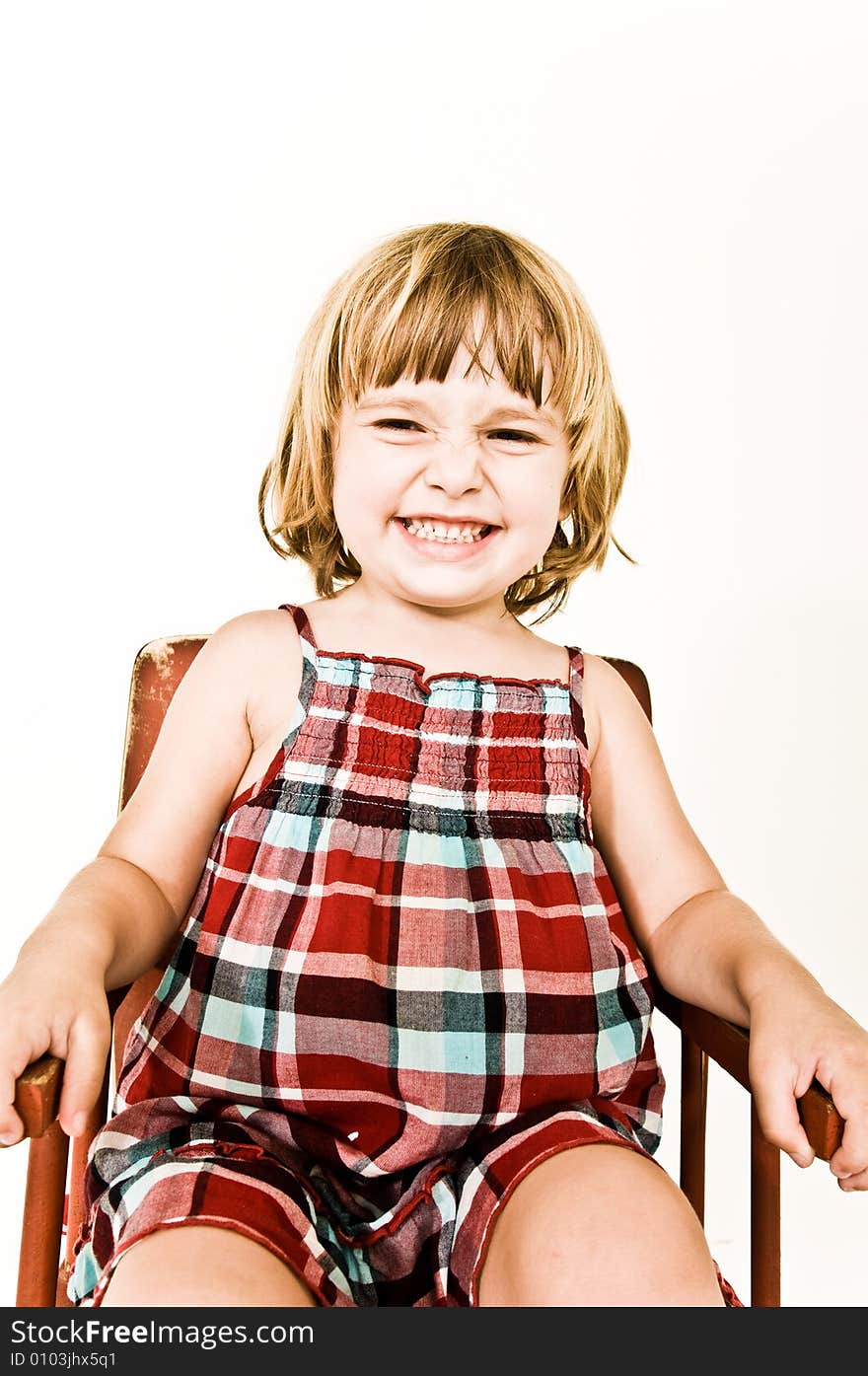 A three year old, girl making faces. A three year old, girl making faces.