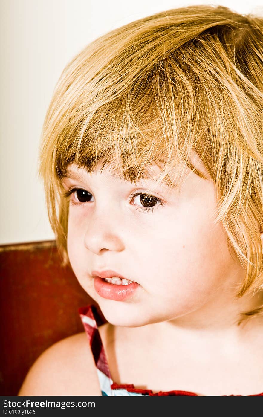 A three year old, girl making faces. A three year old, girl making faces.