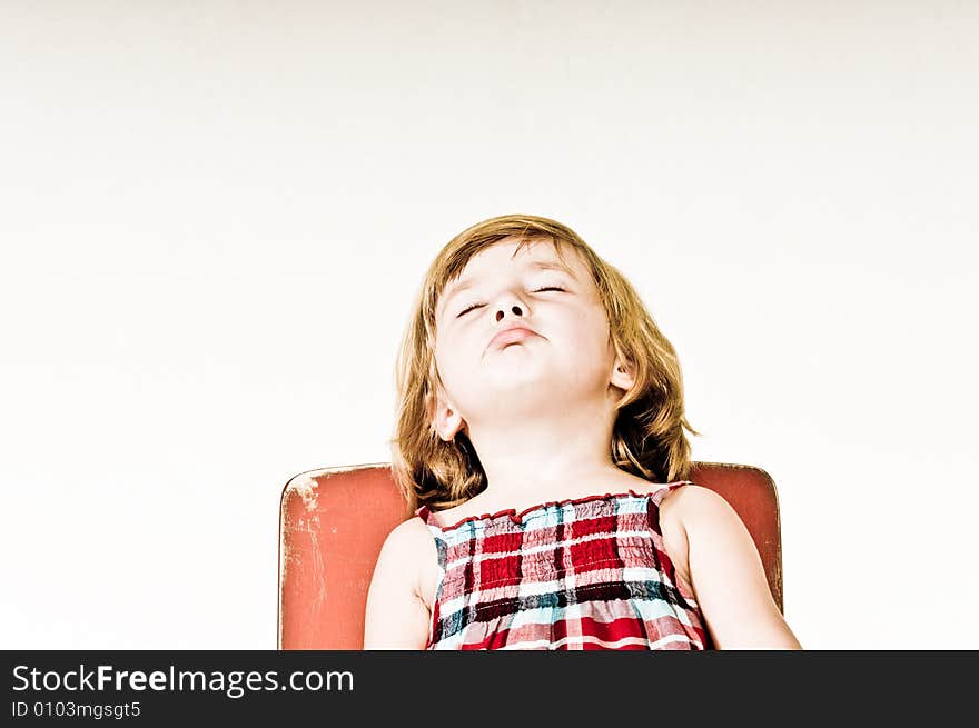 A three year old, girl making faces. A three year old, girl making faces.