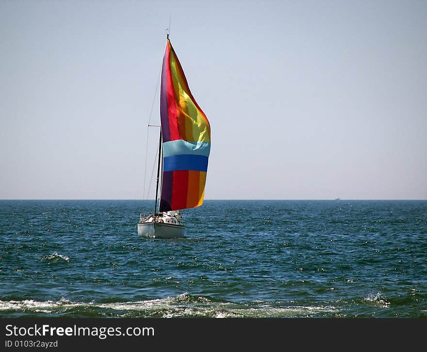 Colorful spinnaker on a summer afternoon. Colorful spinnaker on a summer afternoon.