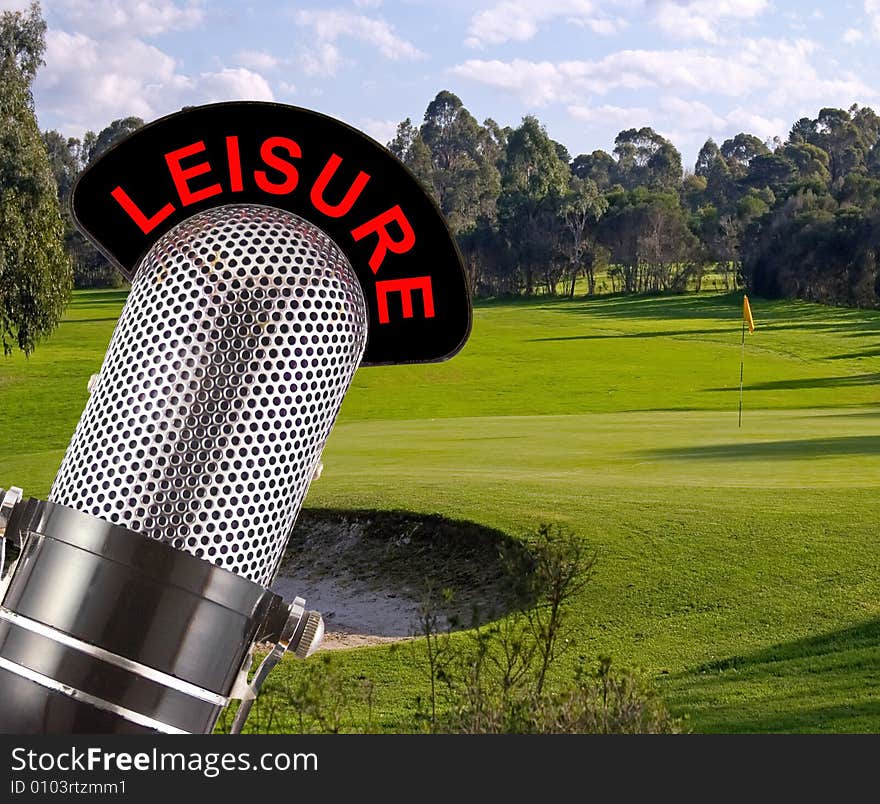 Leisure message on a vintage microphone with golf course in the background.  This image conveys the concept of the importance of leisure in a busy lifestyle.