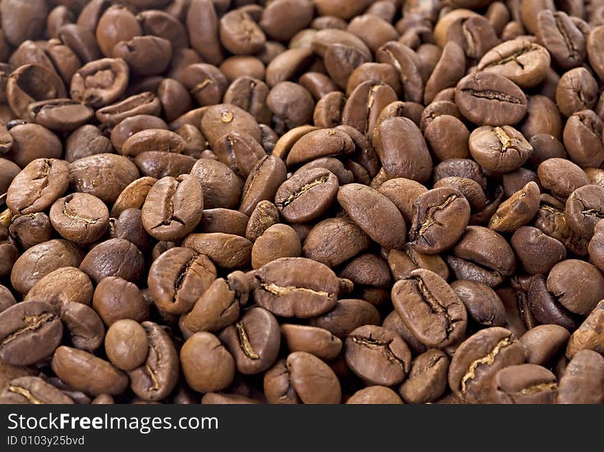 Coffee beans closeup. Astract background. Coffee beans closeup. Astract background.