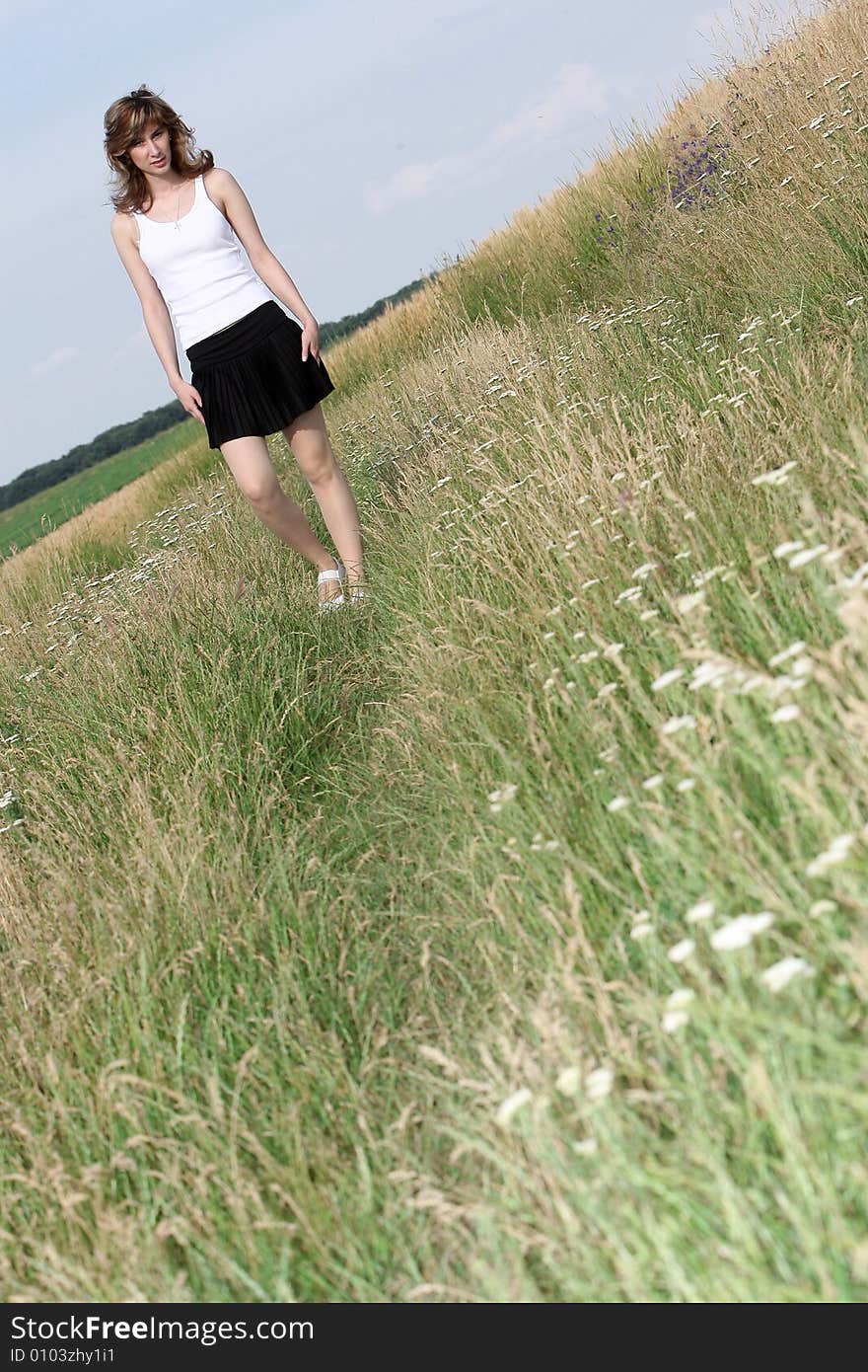 A beautiful girl running on the field