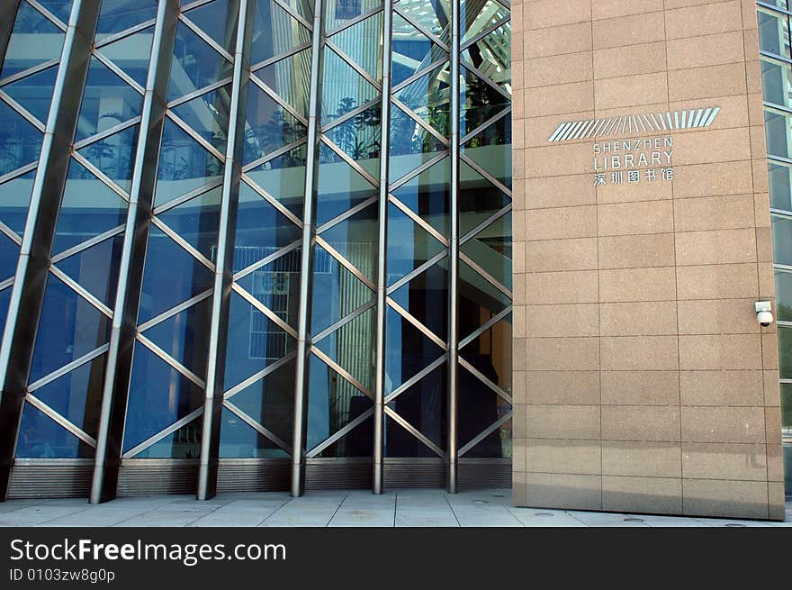 China, Guangdong province, Shenzhen city. Newest library in Futian district. Extraordinary design, special construction, modern looks. Special glass-panel wall with library sign. China, Guangdong province, Shenzhen city. Newest library in Futian district. Extraordinary design, special construction, modern looks. Special glass-panel wall with library sign.