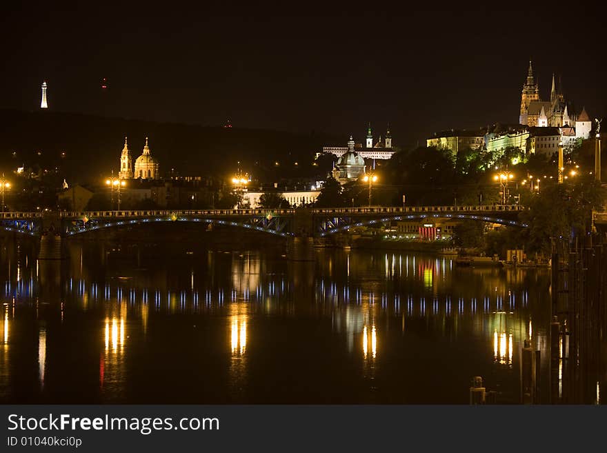 Panoramic night view to Lesser Town, Prague castle, St. Nicholas church and Petrin Tower. Panoramic night view to Lesser Town, Prague castle, St. Nicholas church and Petrin Tower.