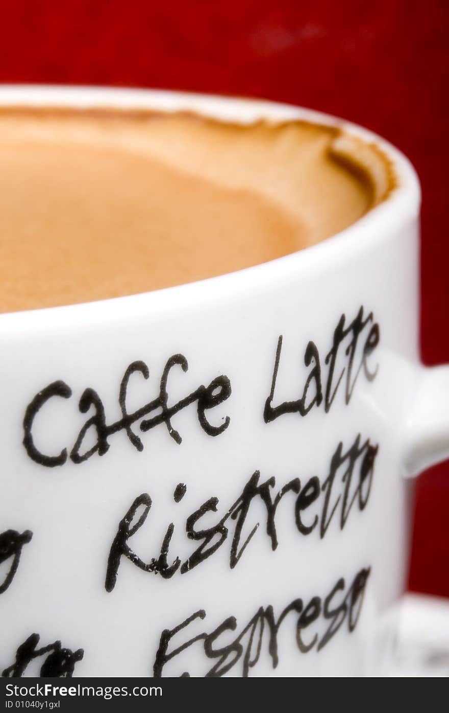 Espresso cup close-up on red background