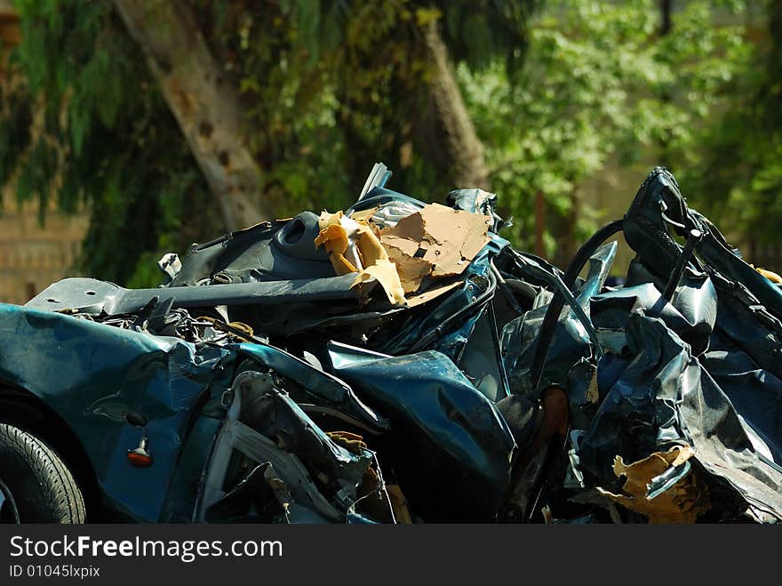 Crashed car and trees