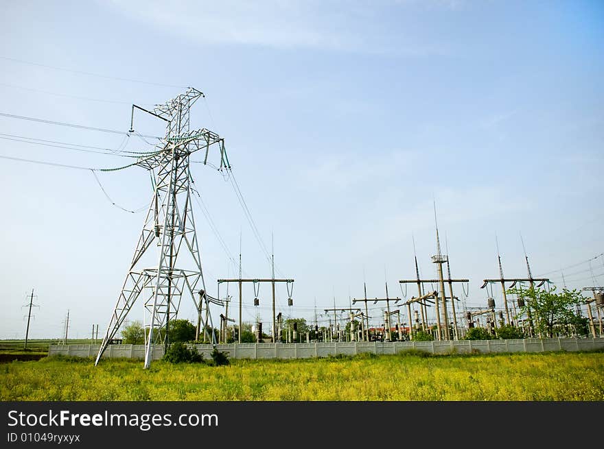 Electrical towers on blue sky background