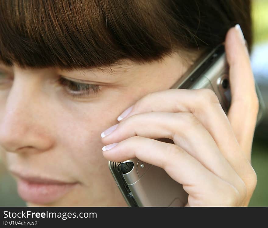 Young female listening on a cell phone