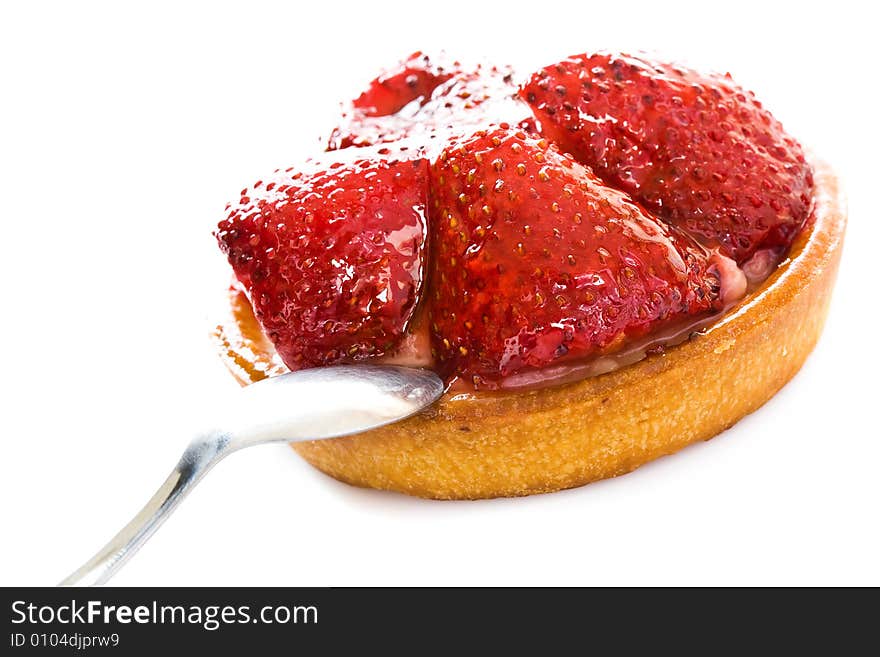 Round cake with parts of a strawberry close up. Round cake with parts of a strawberry close up