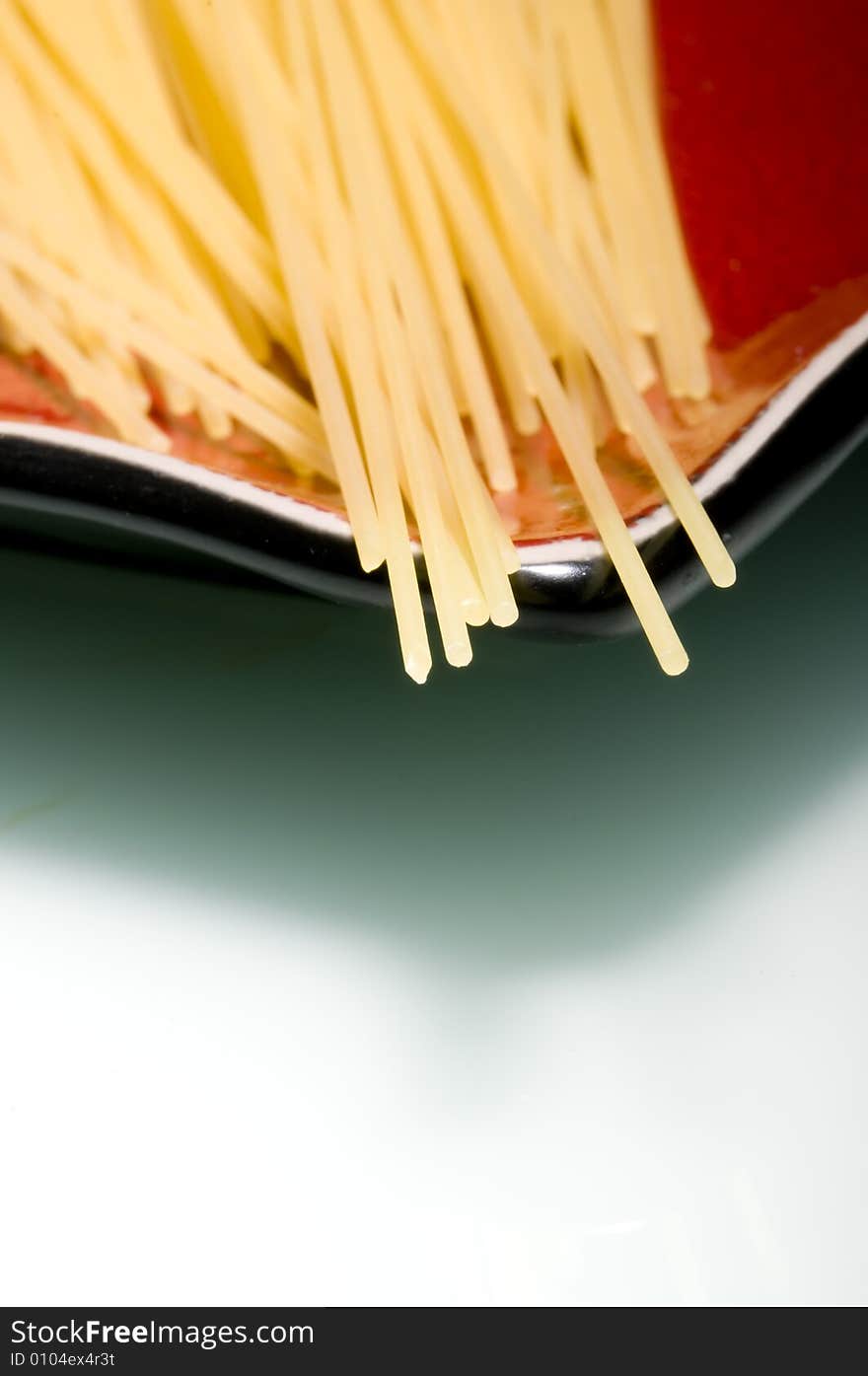 Pasta stripes on red plate. Pasta stripes on red plate