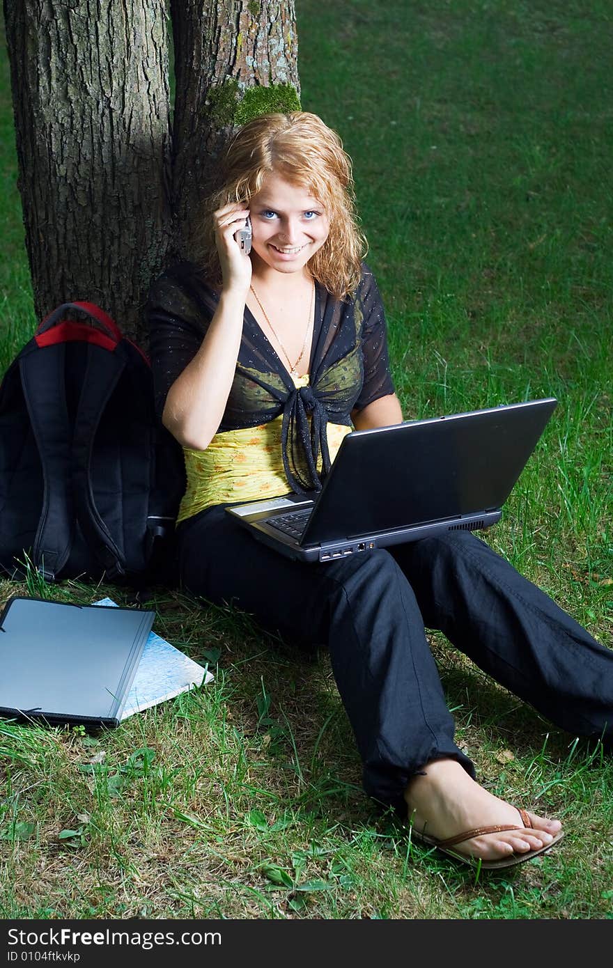 Student girl with laptop in the park. Student girl with laptop in the park.