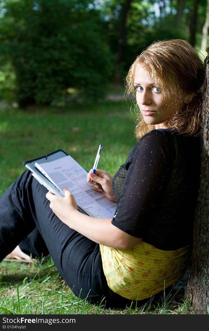 Cute student girl in the park. Cute student girl in the park.