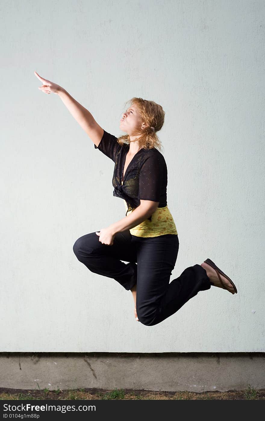 Jumping girl against the wall. Jumping girl against the wall.