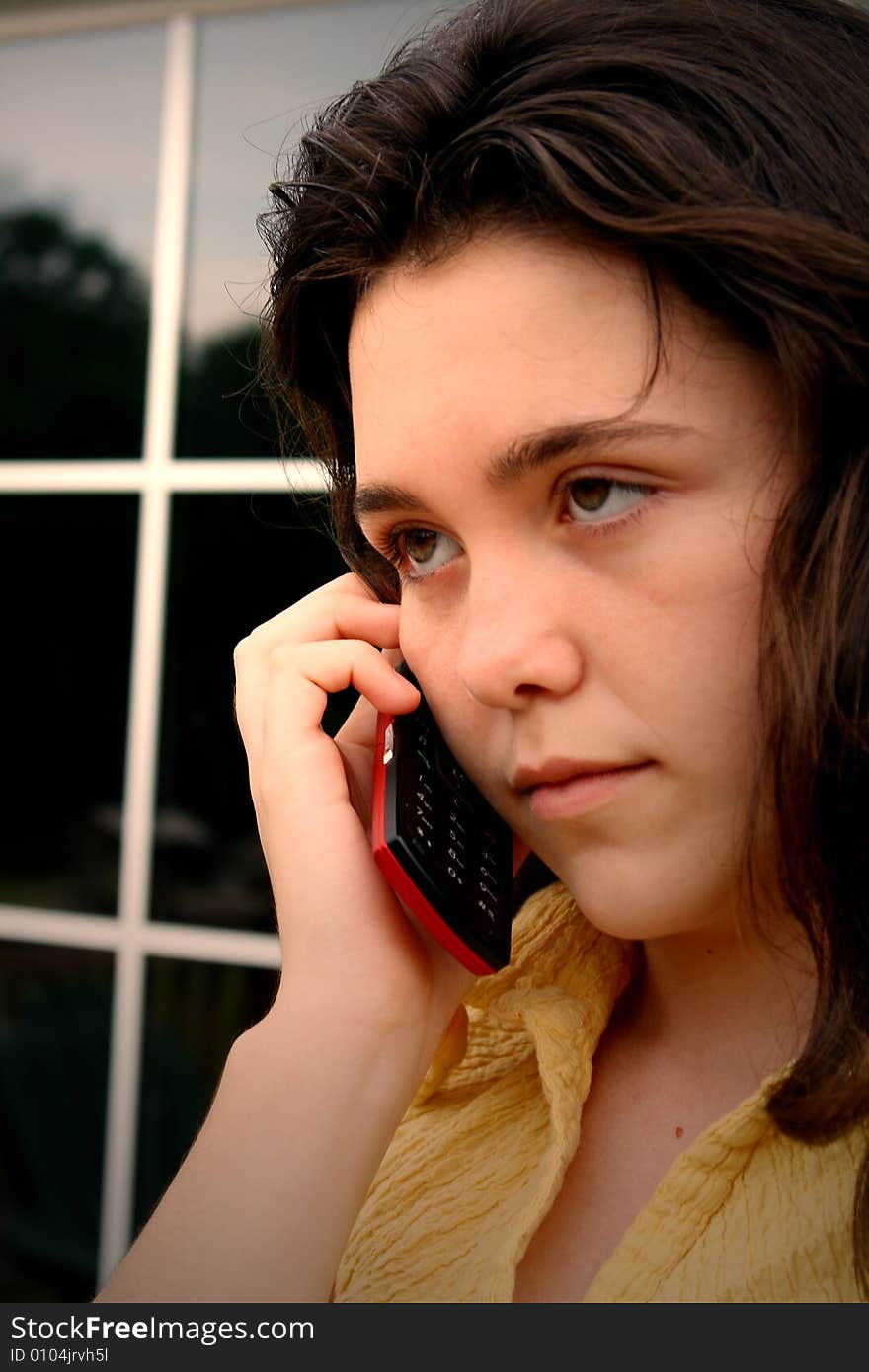 Teen girl mad talking on cell phone