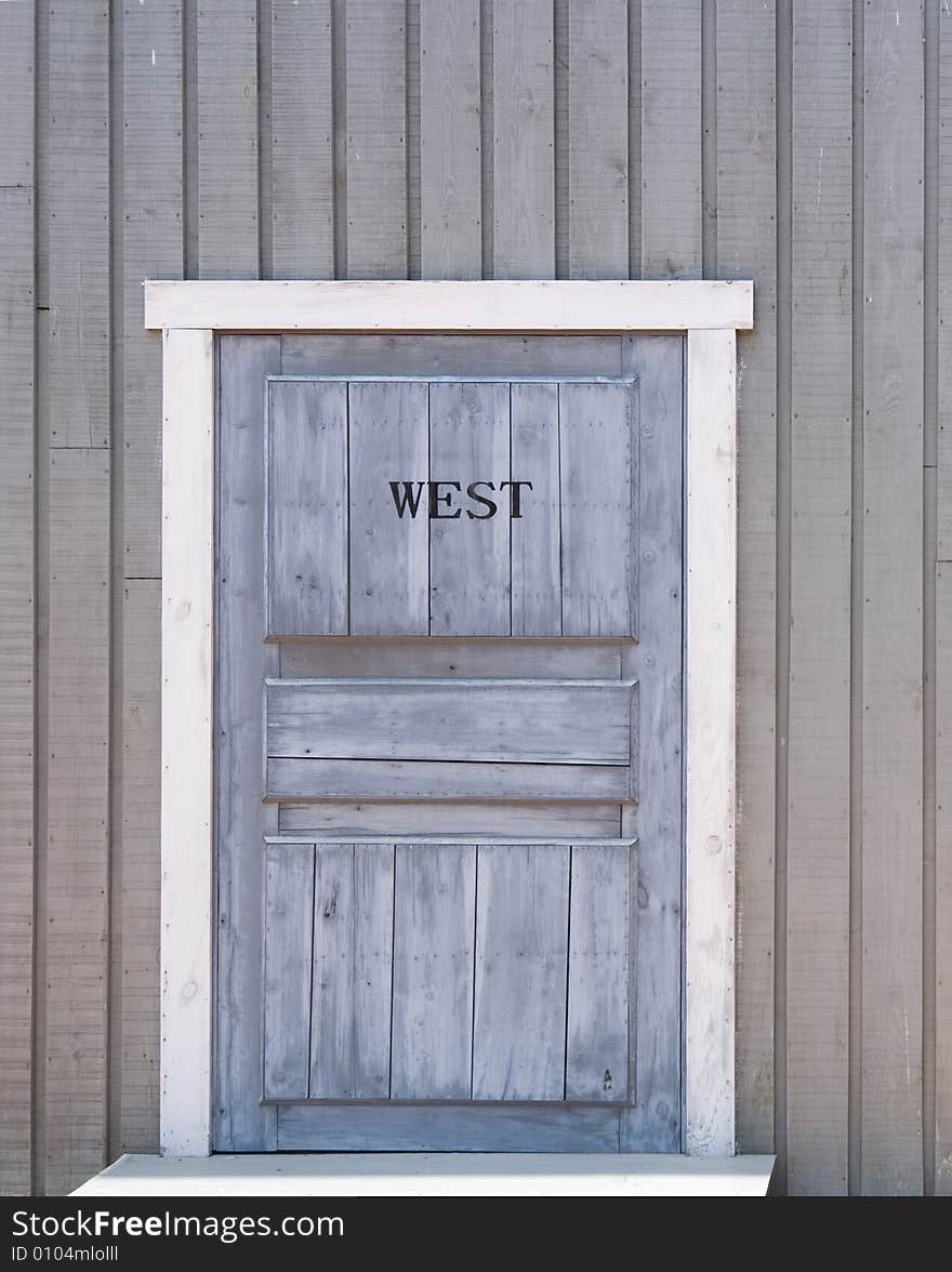 Blue painted door of the wooden house.