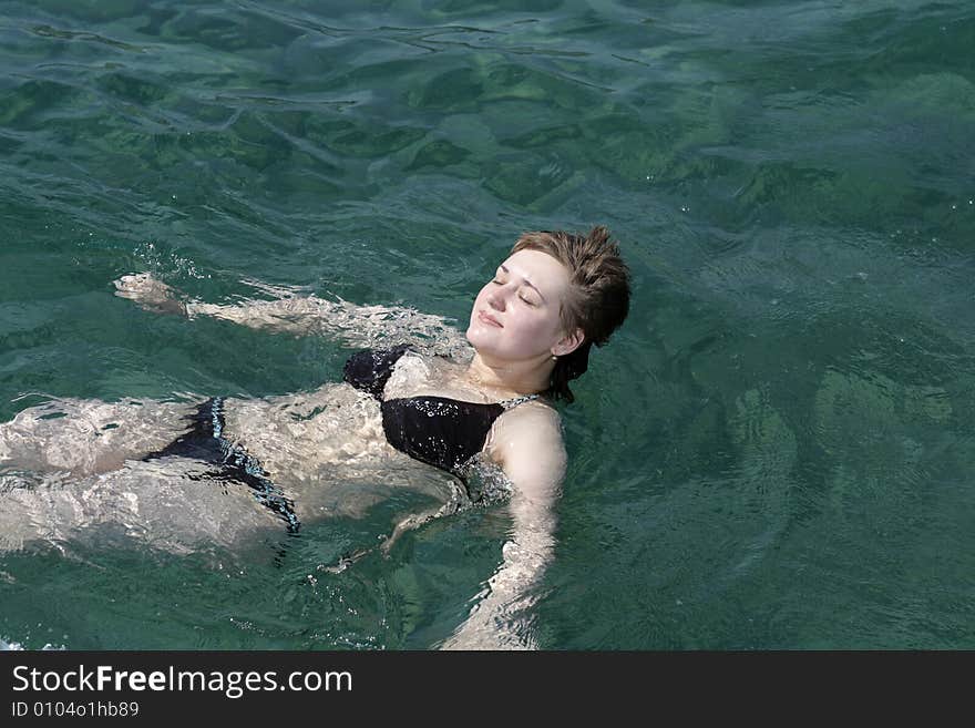 The girl has sunburn in Mediterranean sea. The girl has sunburn in Mediterranean sea