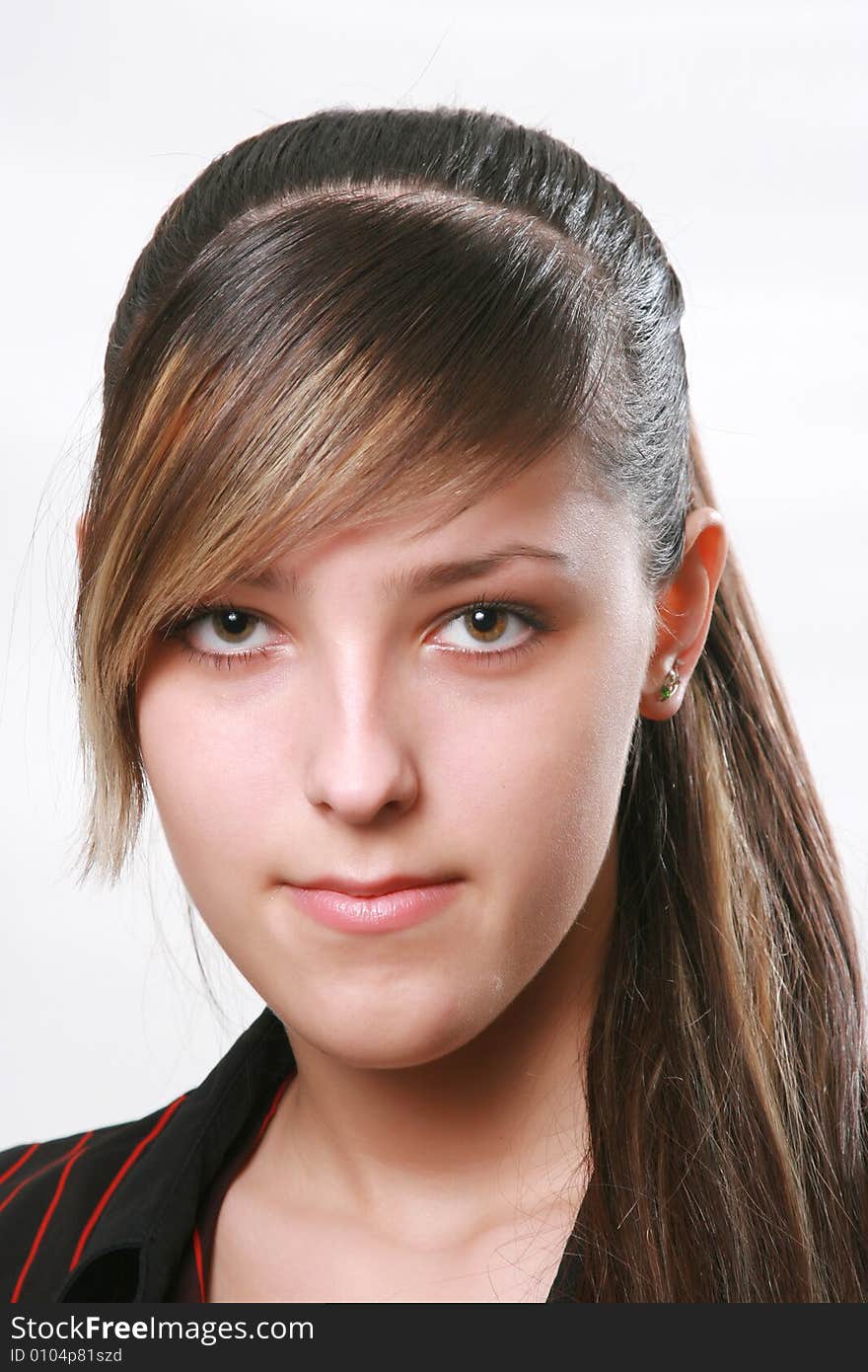 Portrait of the beautiful girl on a white background