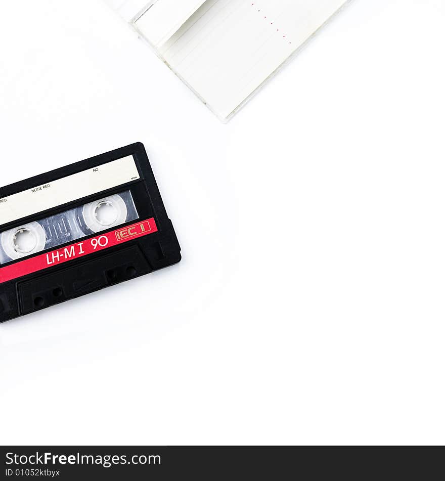 Old cassette and case isolated on white