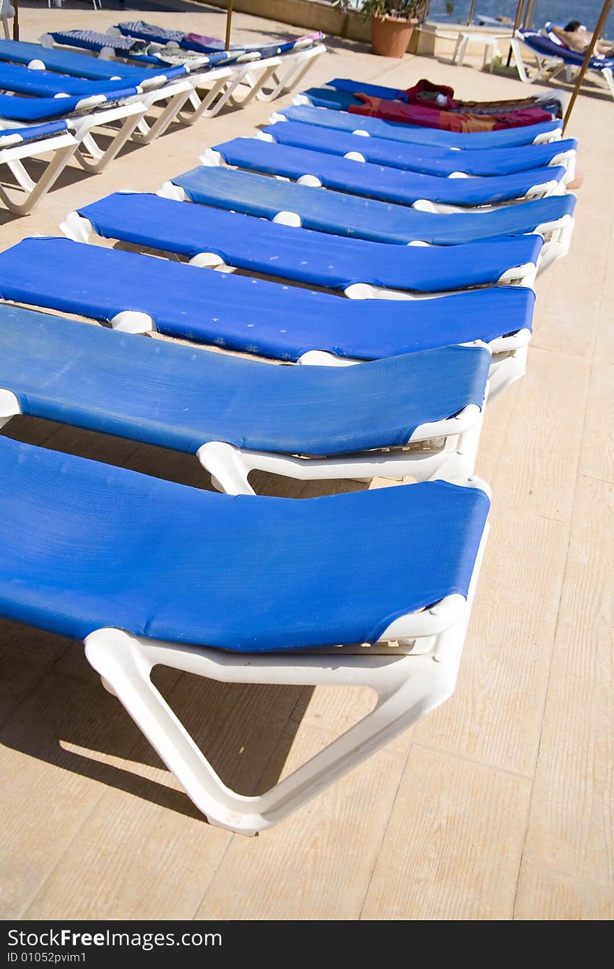 Blue deck-chairs in hotel