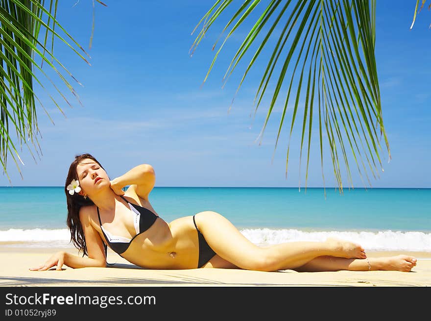 View of a nice young female in tropical environment. View of a nice young female in tropical environment