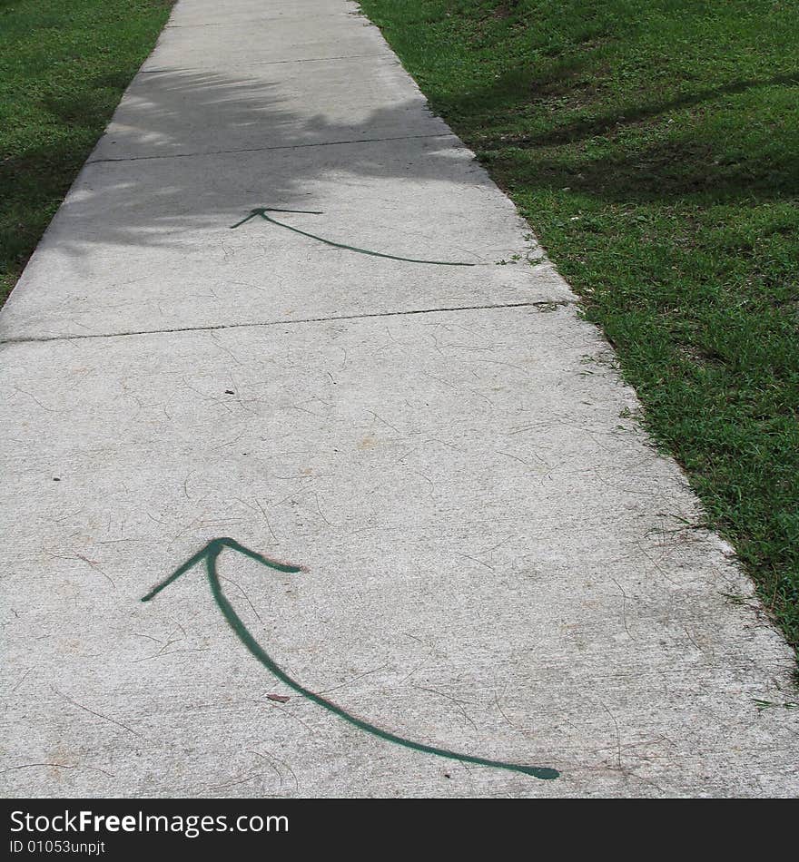 Somebody draw the green arrows on the road in Saipan. Somebody draw the green arrows on the road in Saipan