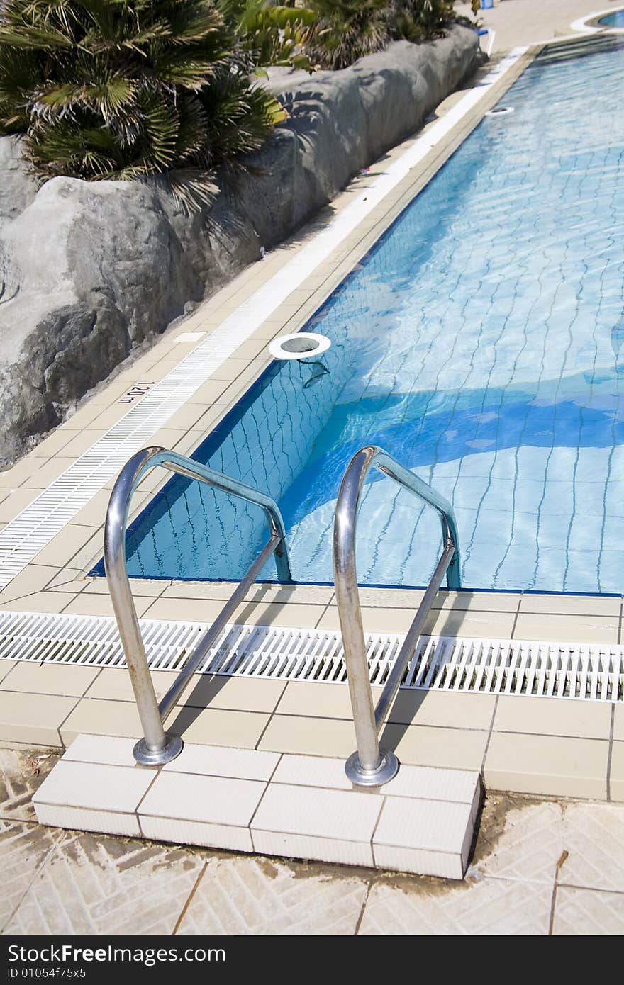 Wellness pool with blue water and rocks