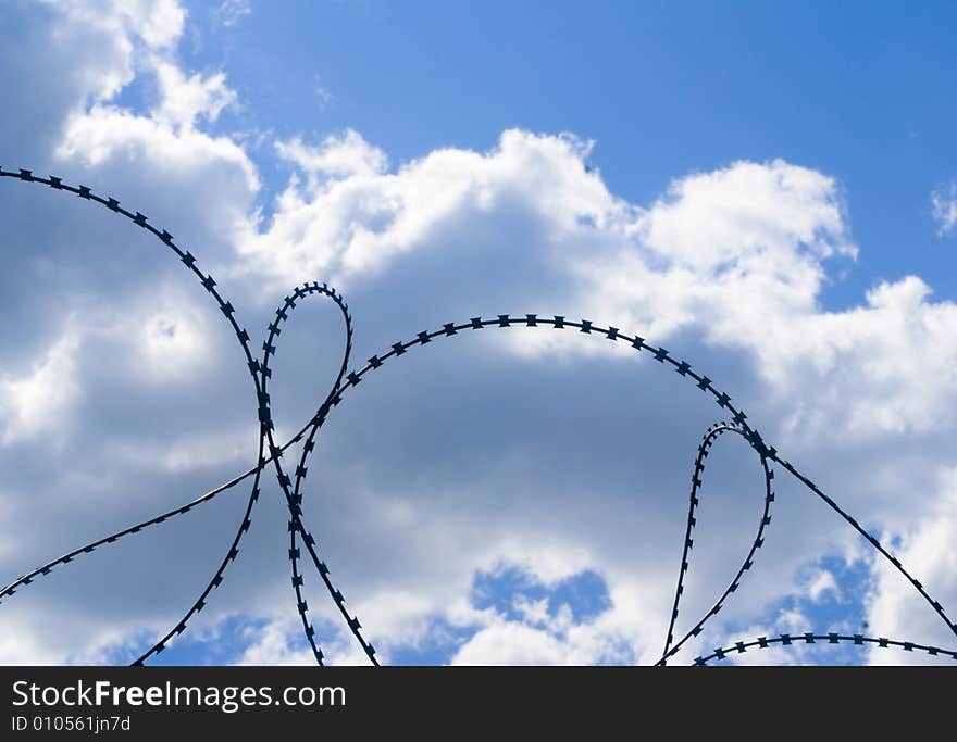 Barbed wire on a background of the sky.