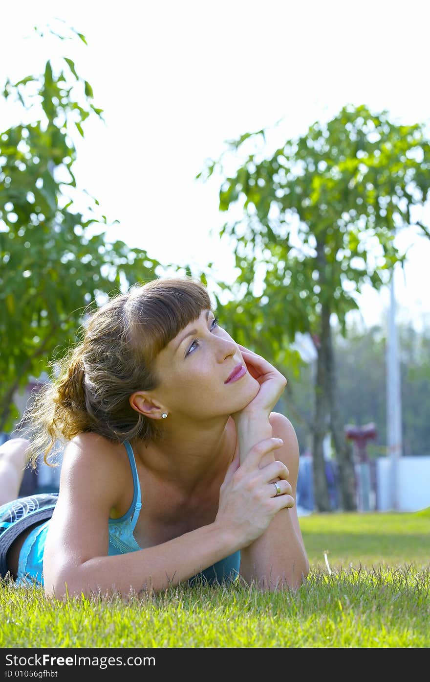 Portrait of young beautiful woman  in summer environment