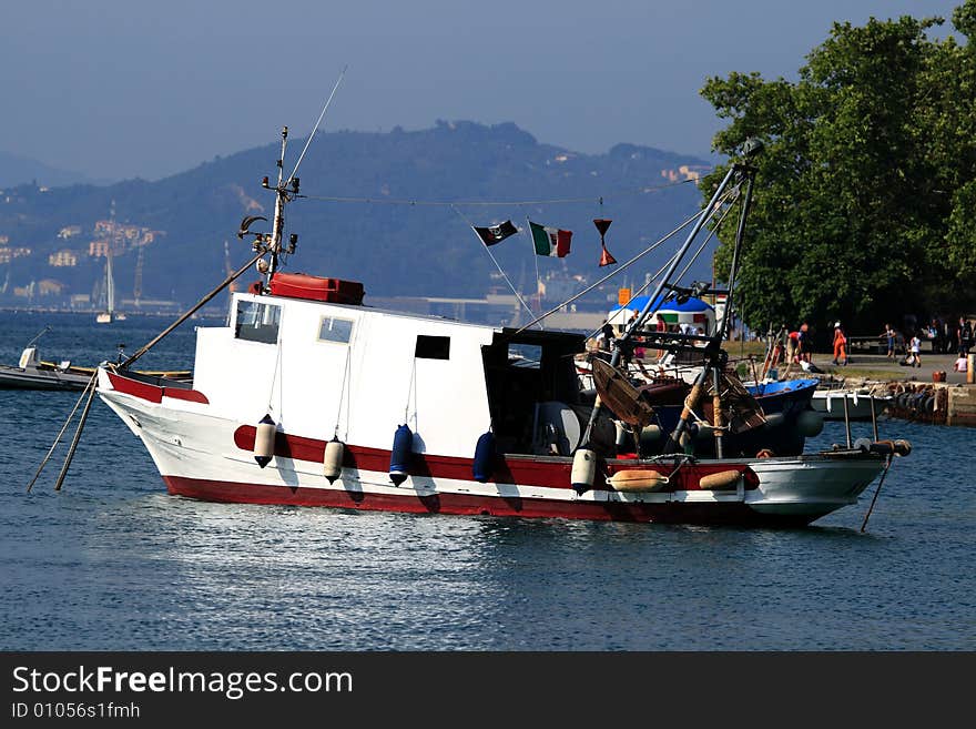 Sunset and moored fishing boat