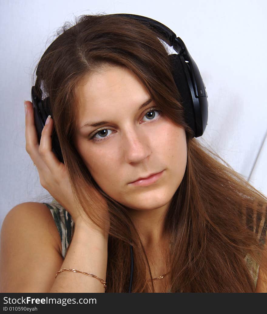 Young girl in headphone listening a music. Young girl in headphone listening a music