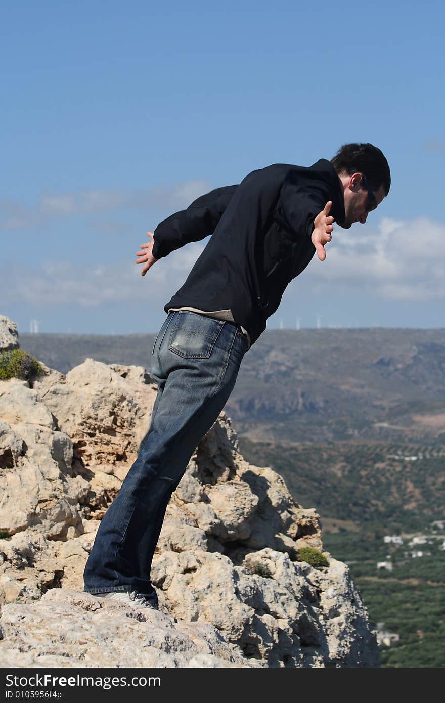 Man leaning against the strong wind