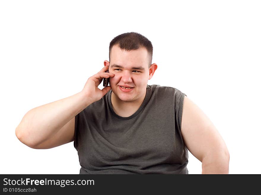 The large man speaks through mobile phone. The large man speaks through mobile phone