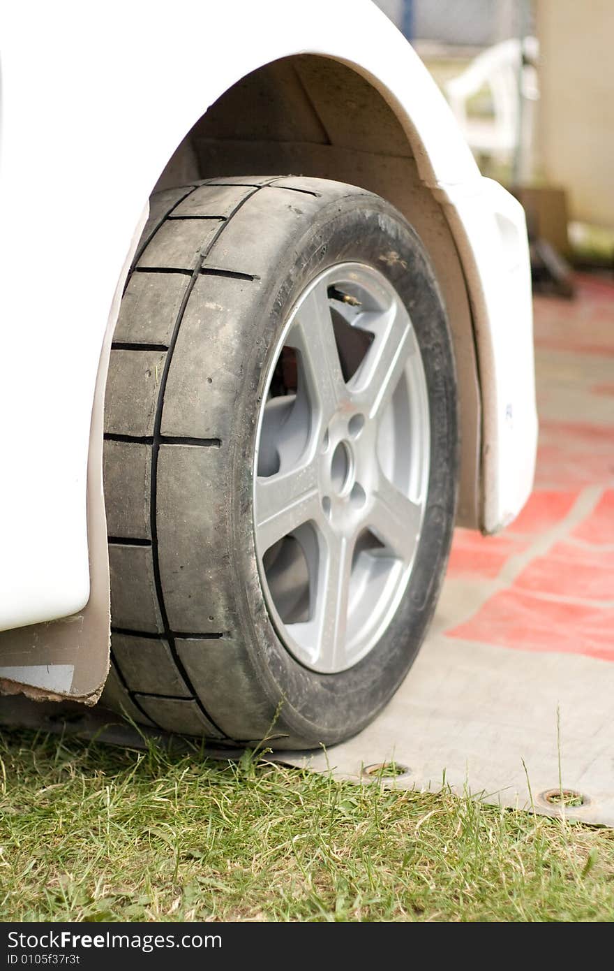 Wheels of the rally car, colored photo. Wheels of the rally car, colored photo