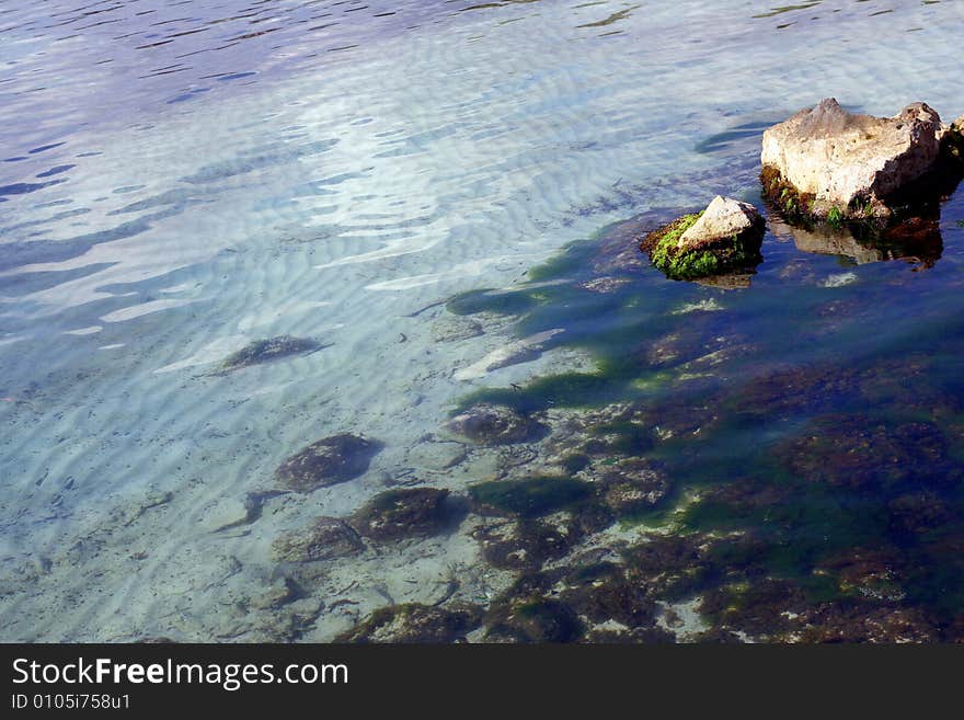 Sea water big stones and sand. Background relax. Sea water big stones and sand. Background relax