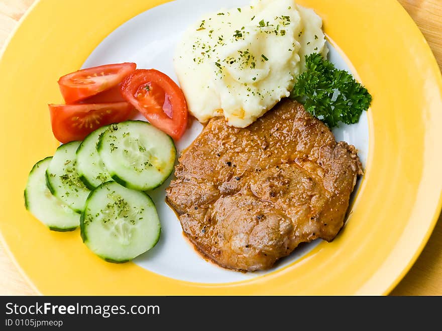 Barbecue with steaks of pork,puree potatoes,salad