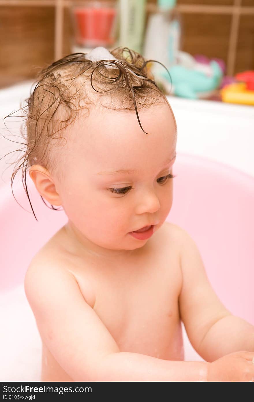 Sweet and happy baby girl in bathroom. Sweet and happy baby girl in bathroom