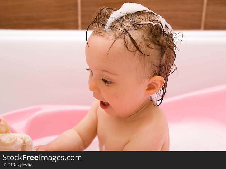 Sweet and happy baby girl in bathroom. Sweet and happy baby girl in bathroom